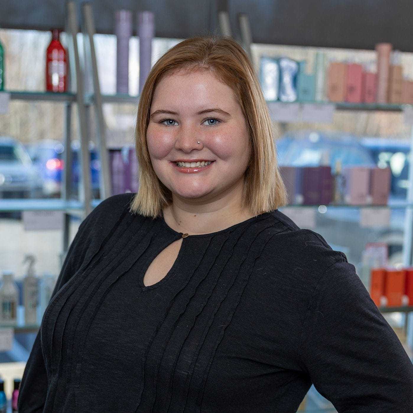 Portrait of Katie, a professional stylist at Platinum Hair Salon, showcasing their expertise and style.