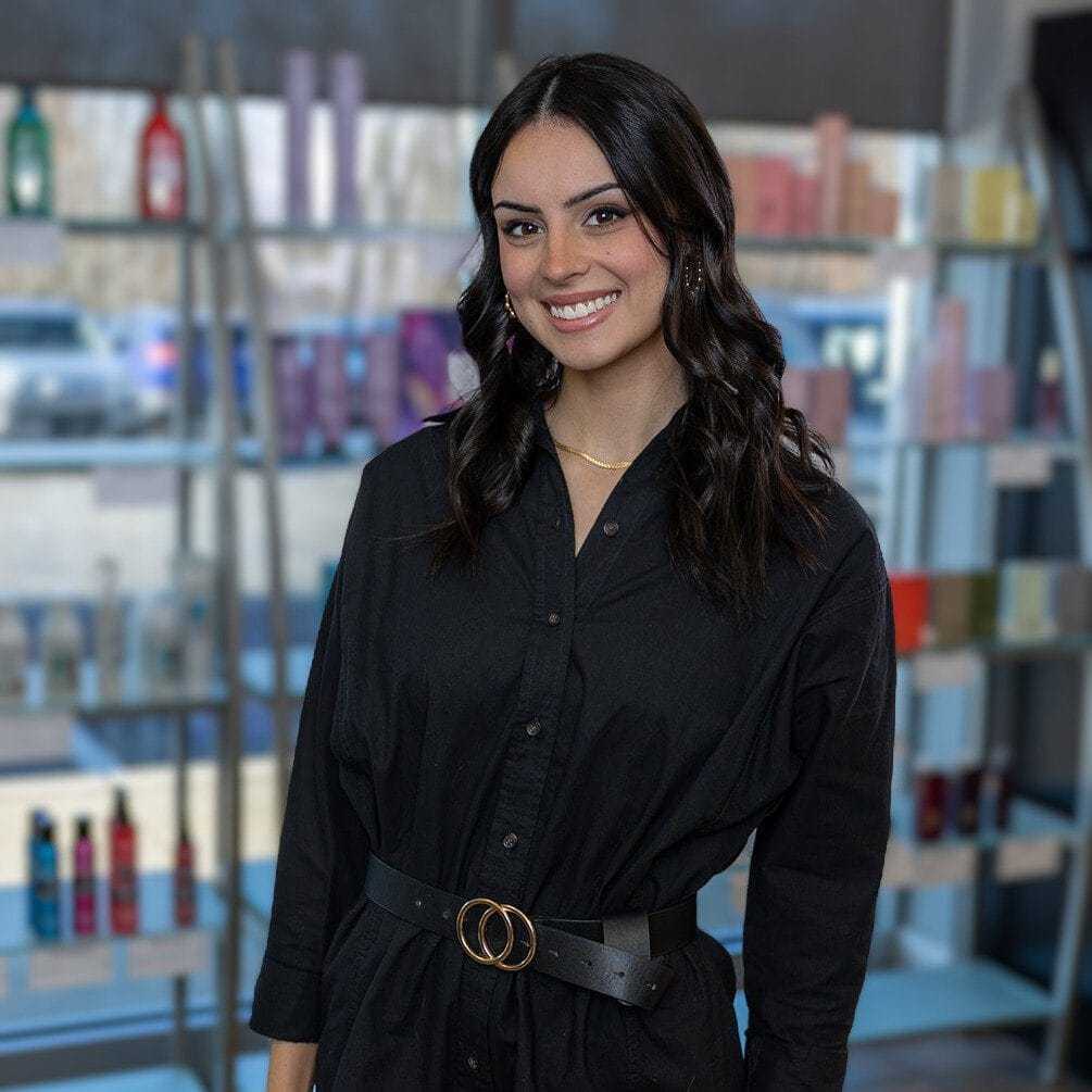 Portrait of Amy, a professional stylist at Platinum Hair Salon, showcasing their expertise and style.