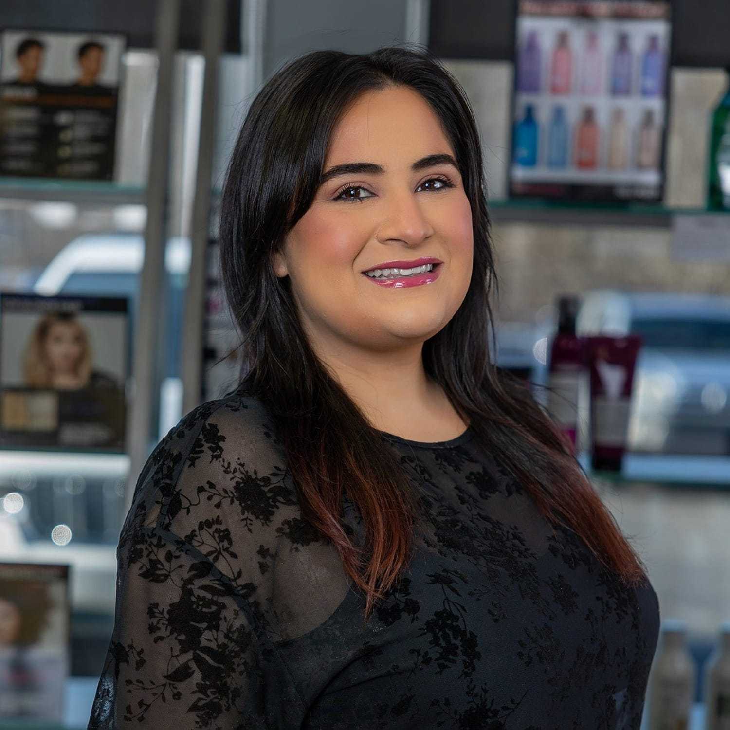 Portrait of Gina Marie, a professional stylist at Platinum Hair Salon, showcasing their expertise and style.